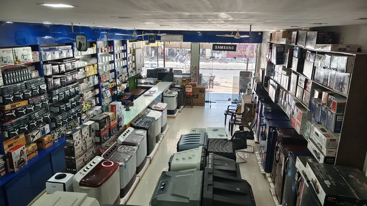 Wide view of the shop showing appliance displays, stocked shelves and the entrance